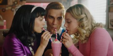 Lili Reinhart KJ Apa and Camila Mendes sharing a milkshake in Riverdale