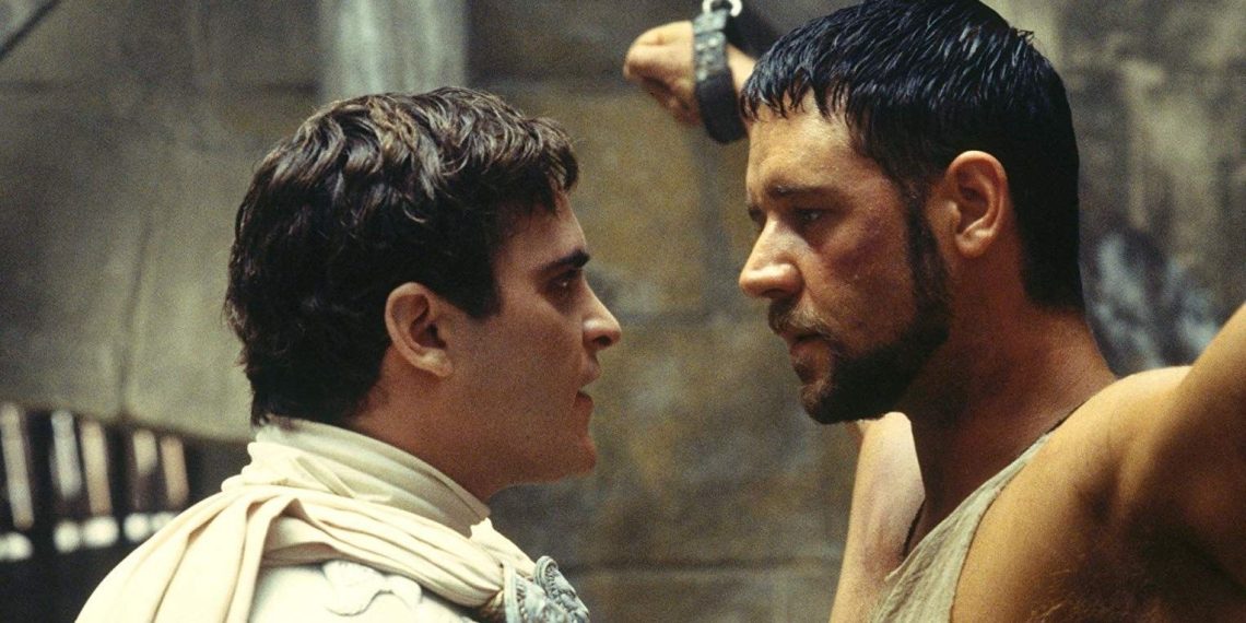 Maximus-and-Commodus-stare-at-each-other-while-Maximus-is-in-chains