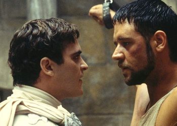 Maximus-and-Commodus-stare-at-each-other-while-Maximus-is-in-chains