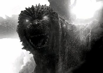 Godzilla with glowing eyes in the black and white version of godzilla minus one